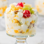 Ambrosia salad in a glass trifle cup.