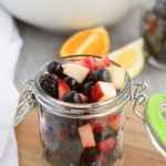 Mixed fruit in a small jar.