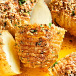 Hasselback potato on a fork.