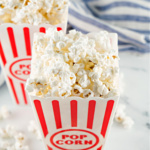 Popcorn in a red and white container.