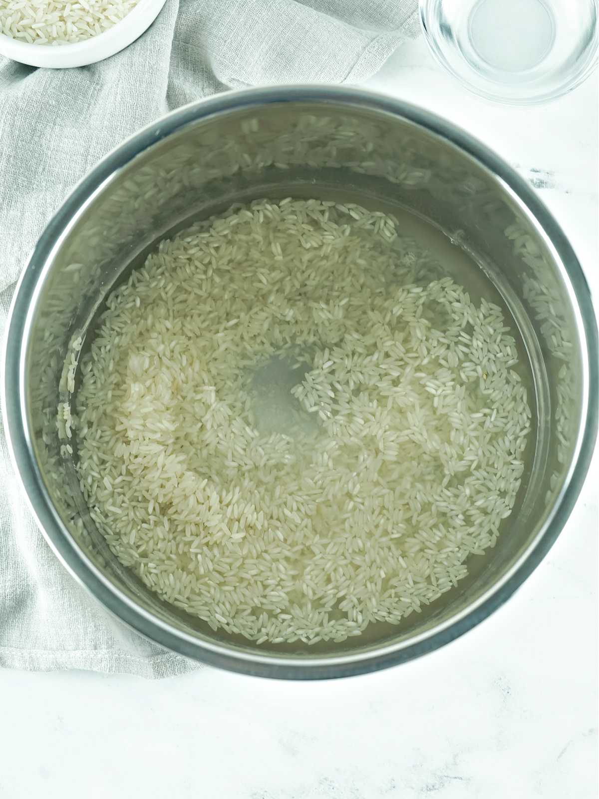 Water and rice in the bowl of an Instant Pot.