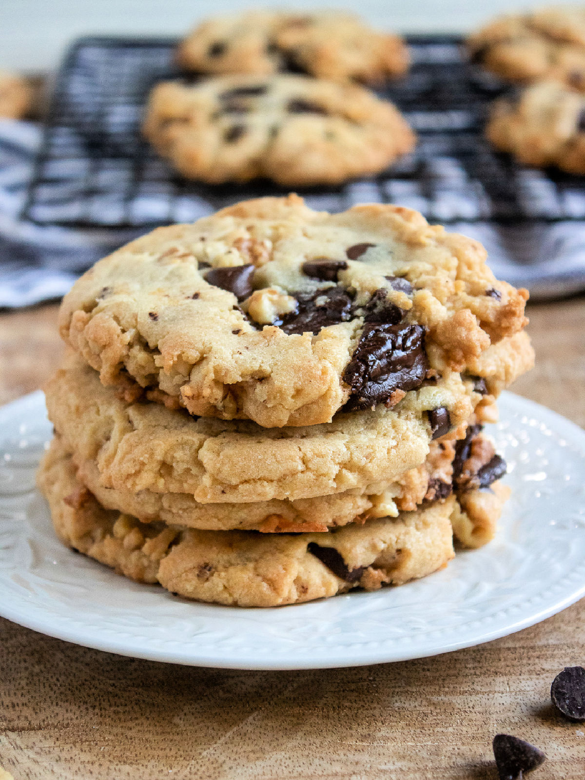 Stack of walnut chocolate chunk cookies.