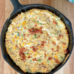 Cheesy chicken bacon ranch dip in a skillet.