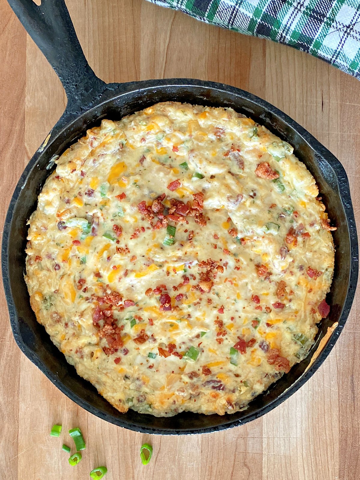 Cheesy chicken bacon ranch dip in a skillet.