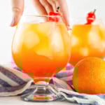 Woman's hand getting a Sex on the Beach drink.