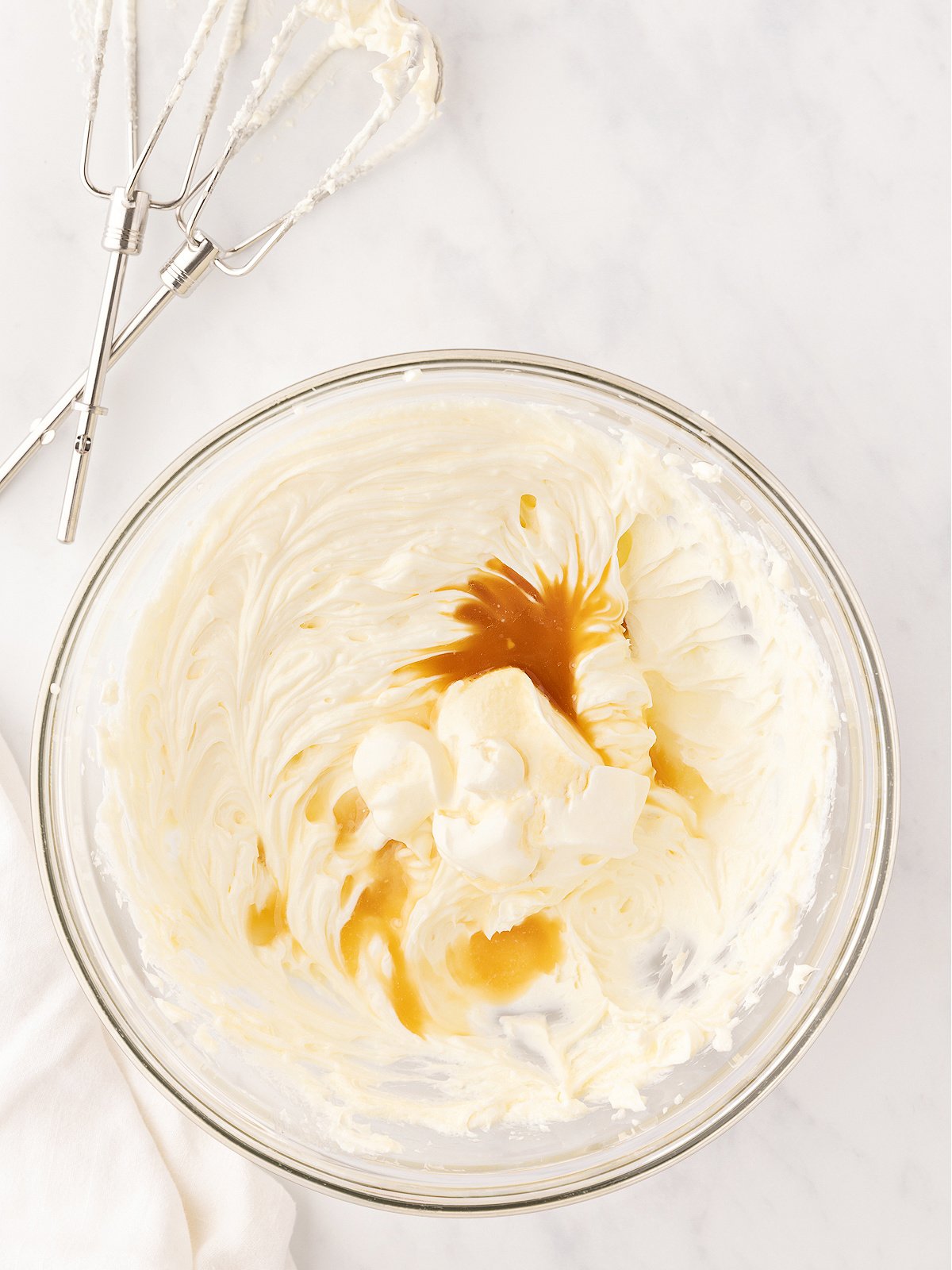 Lemon juice and vanilla on top of beaten cream cheese.