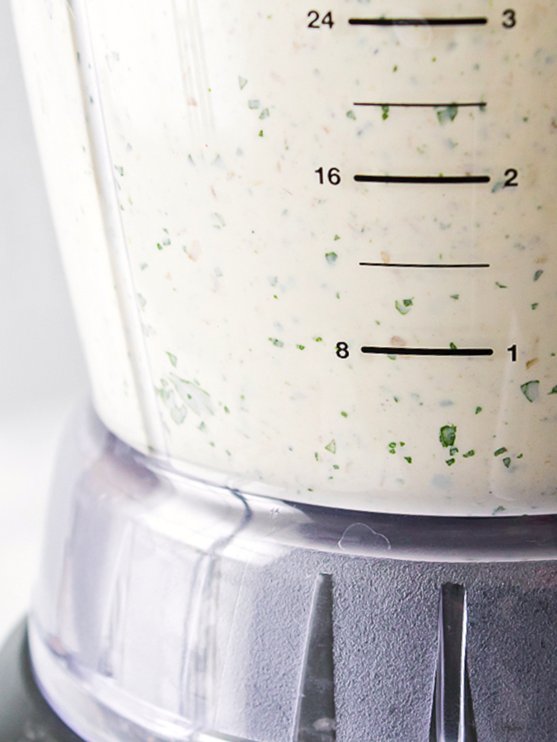 Smooth, blended jalapeño ranch dressing inside a blender jar.