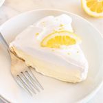 A slice of lemon ice box pie on a plate.