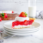 Slice of strawberry pie on a plate.