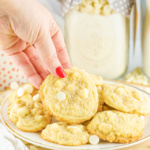 Woman's hand picking up a cookie.