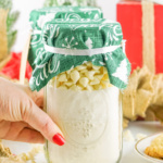 Jar of cookie mix topped with festive green fabric.