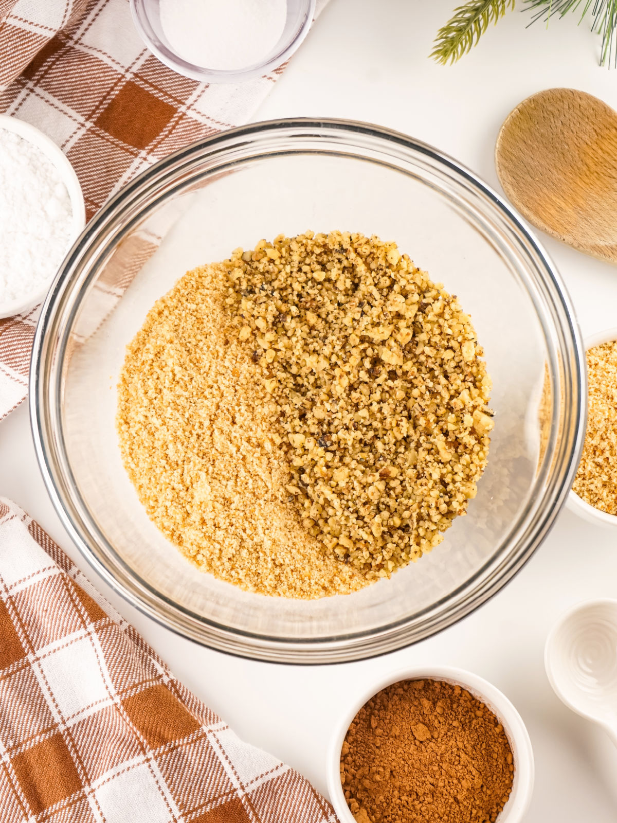 Chopped walnuts and crushed vanilla wafers in a mixing bowl.
