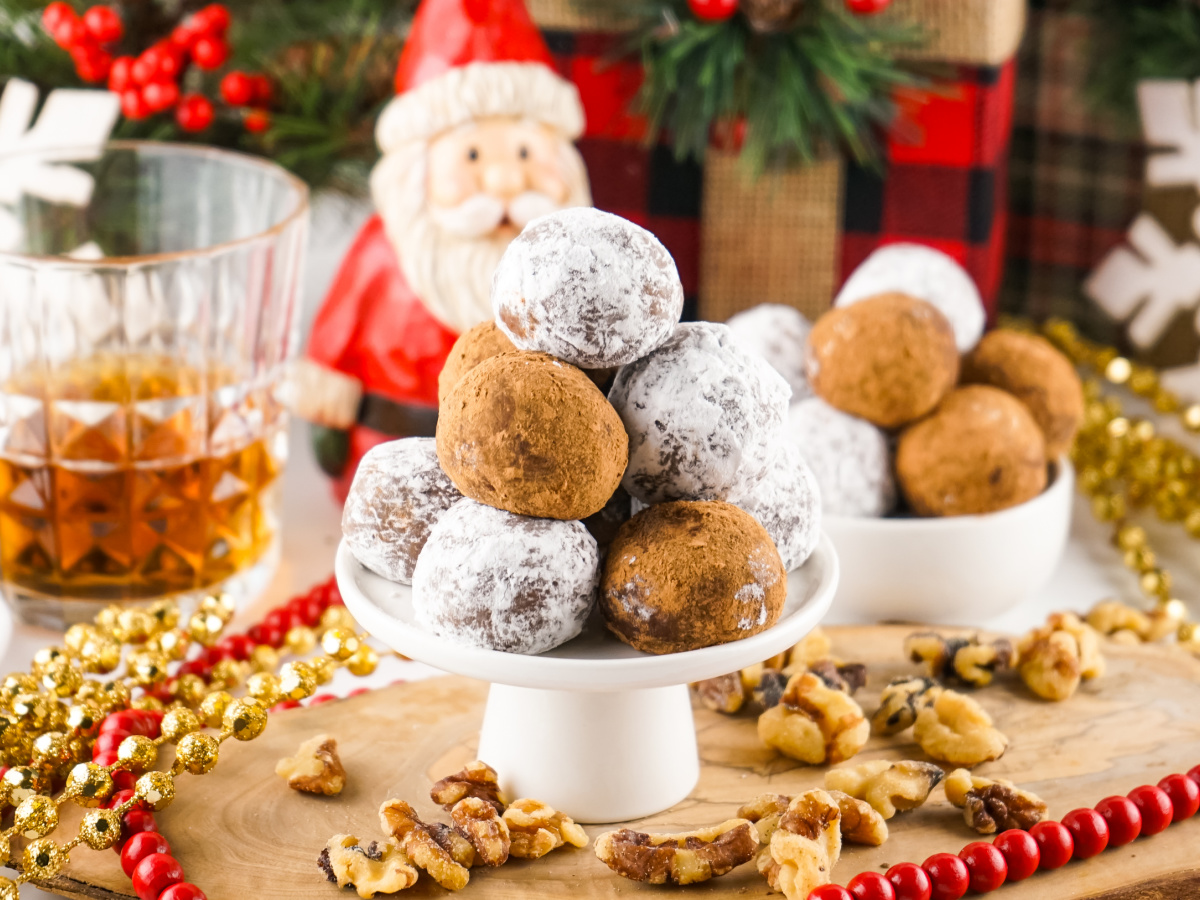Cake platter topped with rum balls.