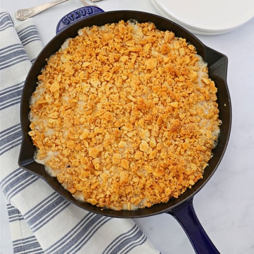 Chicken and rice casserole with Ritz in a cast iron skillet.