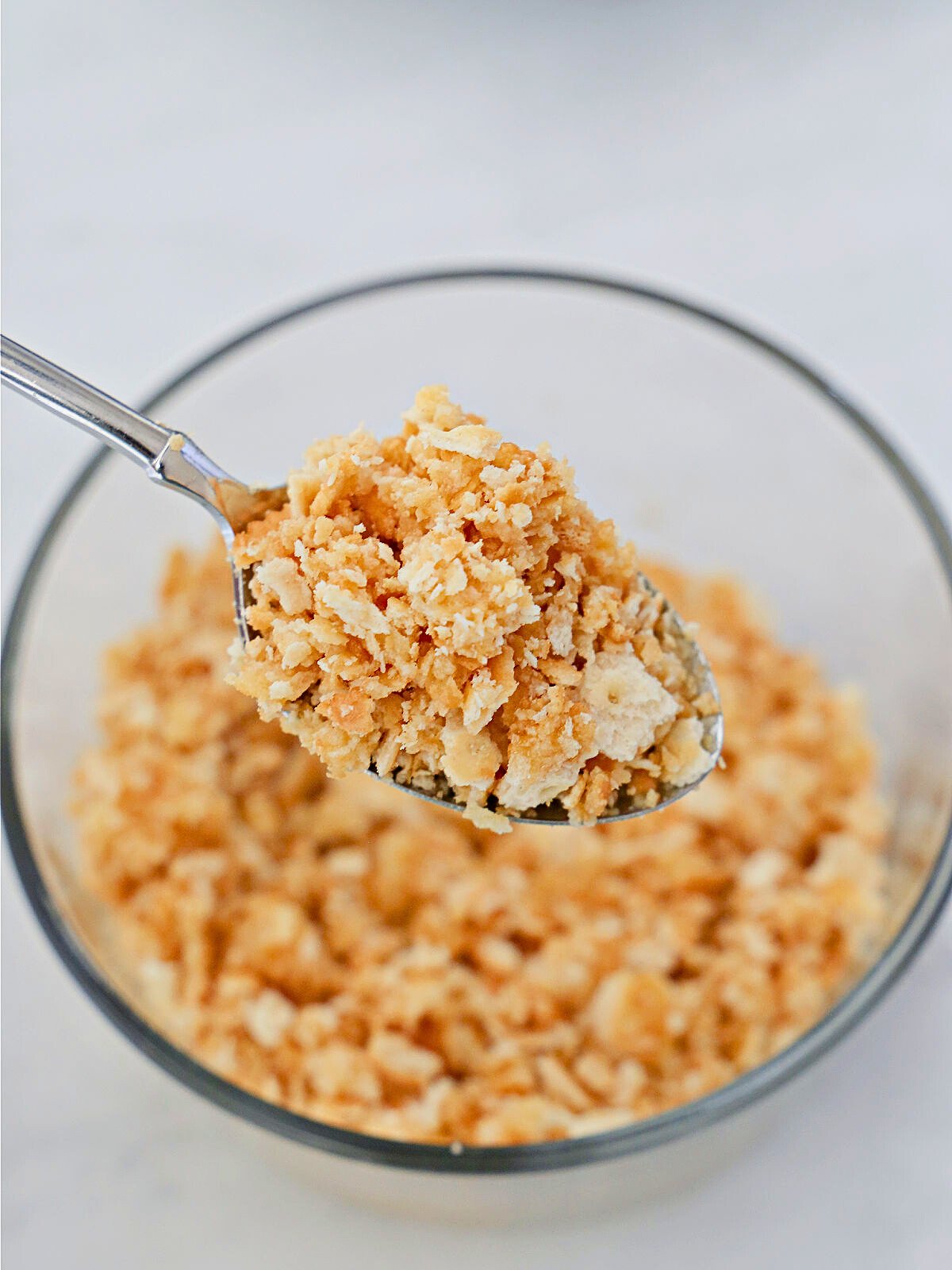 Scoop of crushed Ritz crackers.