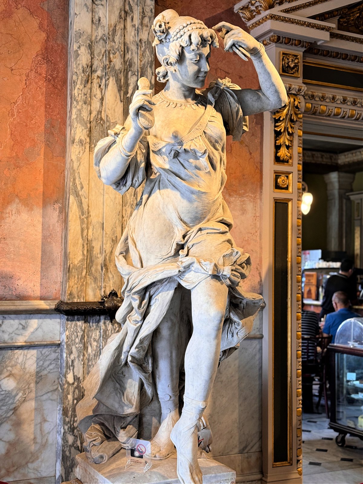Statue of a woman inside of the National Theater.