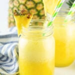 Two glasses of pineapple agua fresca.