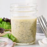 Pint size Mason jar filled with dressing.