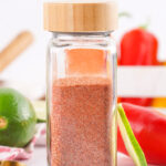Chili seasoning in a glass spice jar.