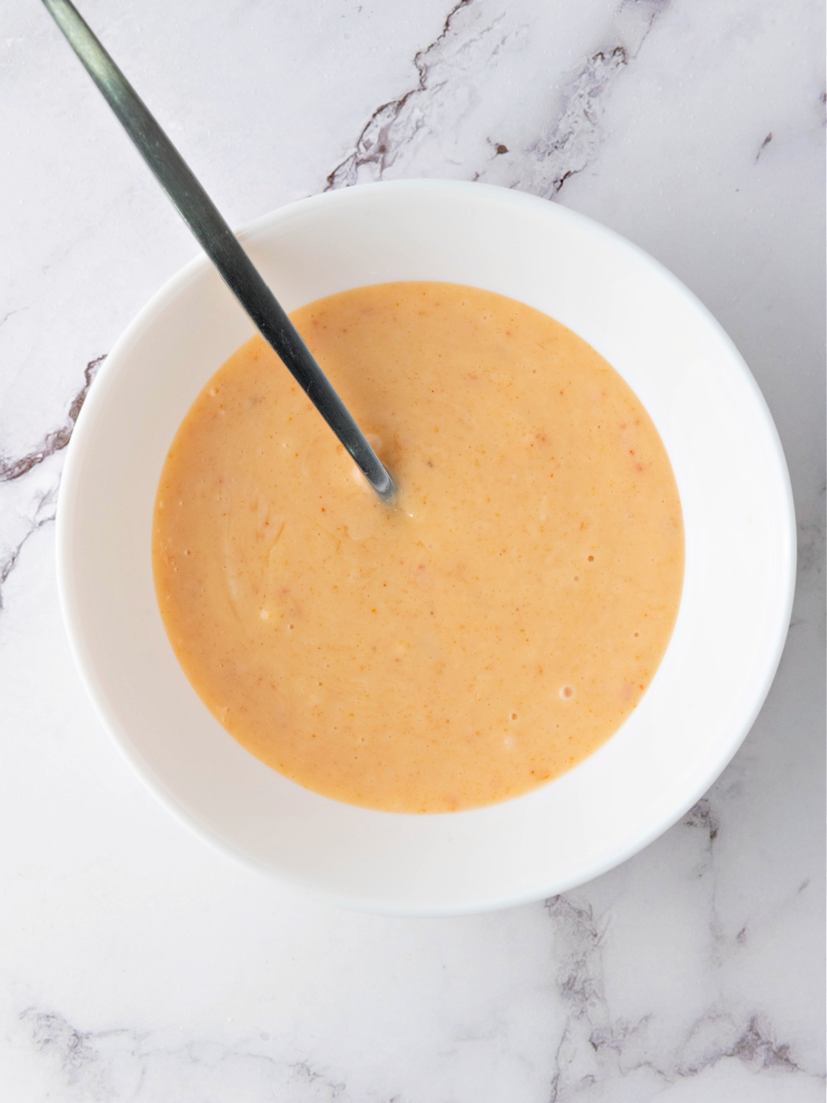Bang bang sauce stirred until smooth and creamy.