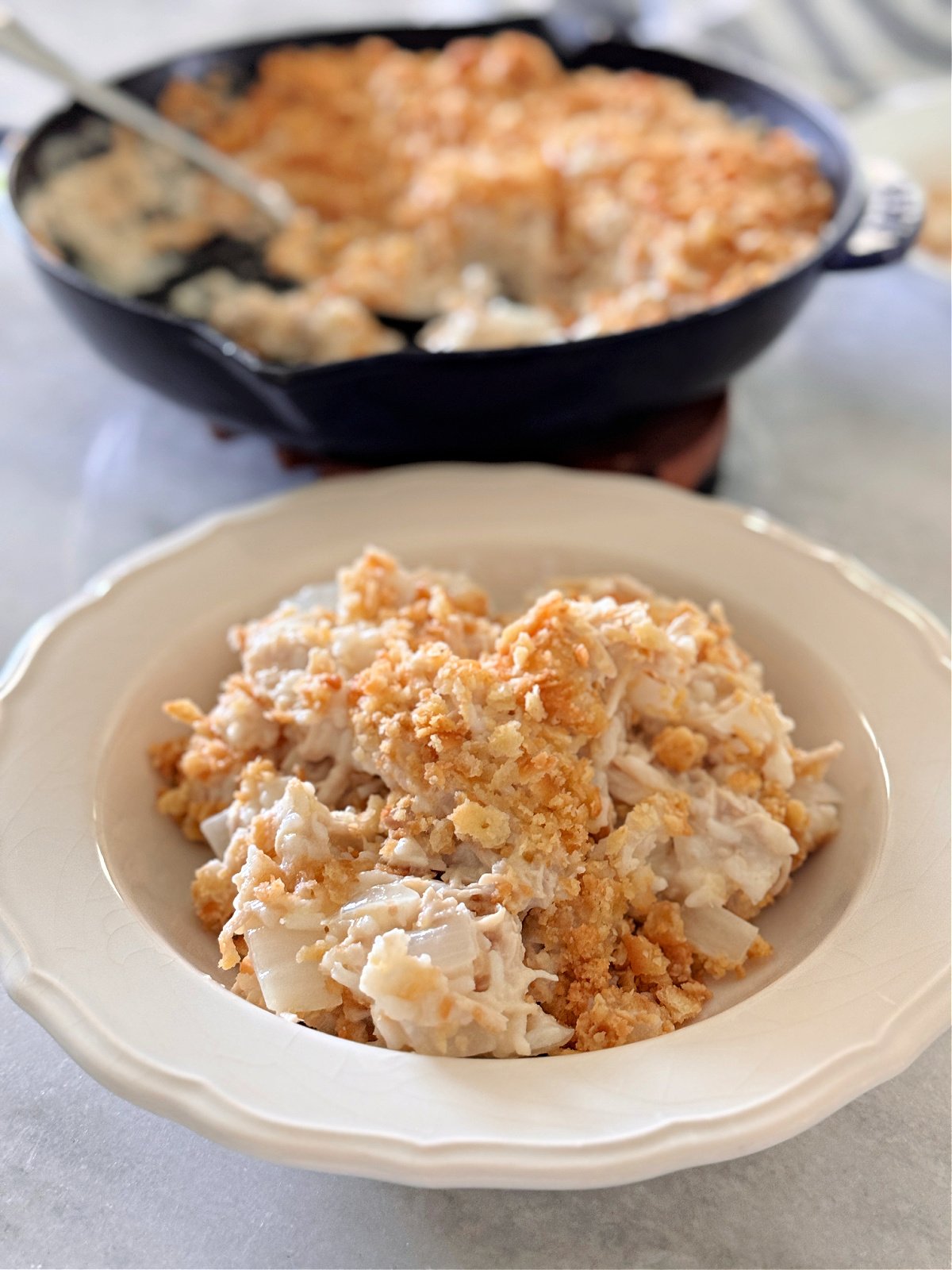Bowl of chicken and rice topped with Ritz cracker topping.