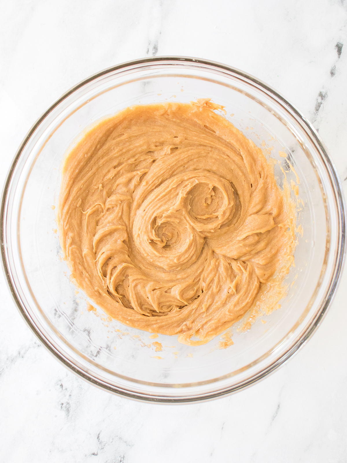 Creamy batter in a glass bowl.