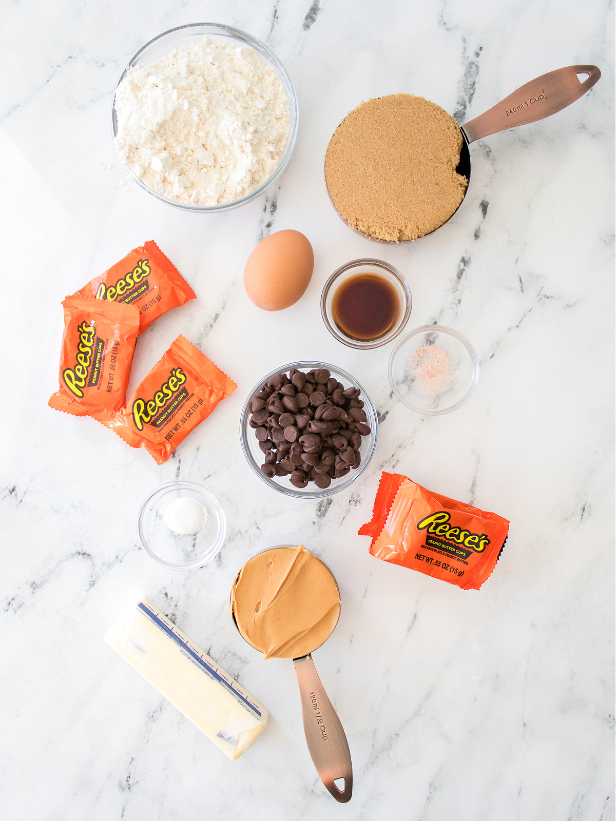 Flour, brown sugar, egg, vanilla, salt, chocolate chips, peanut butter, butter, and Reese's cups.