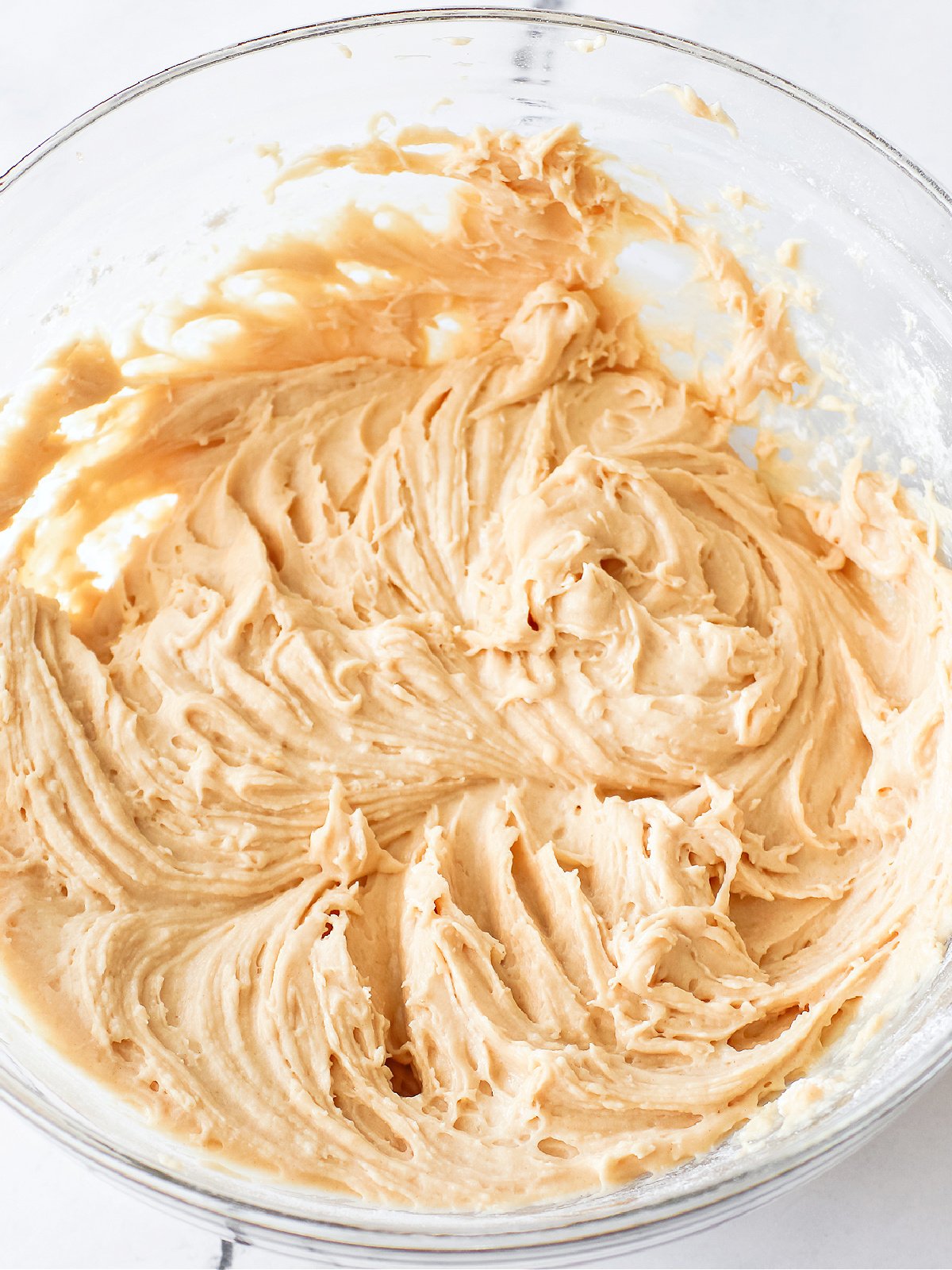 Bowl of muffin batter ready to add blueberries.