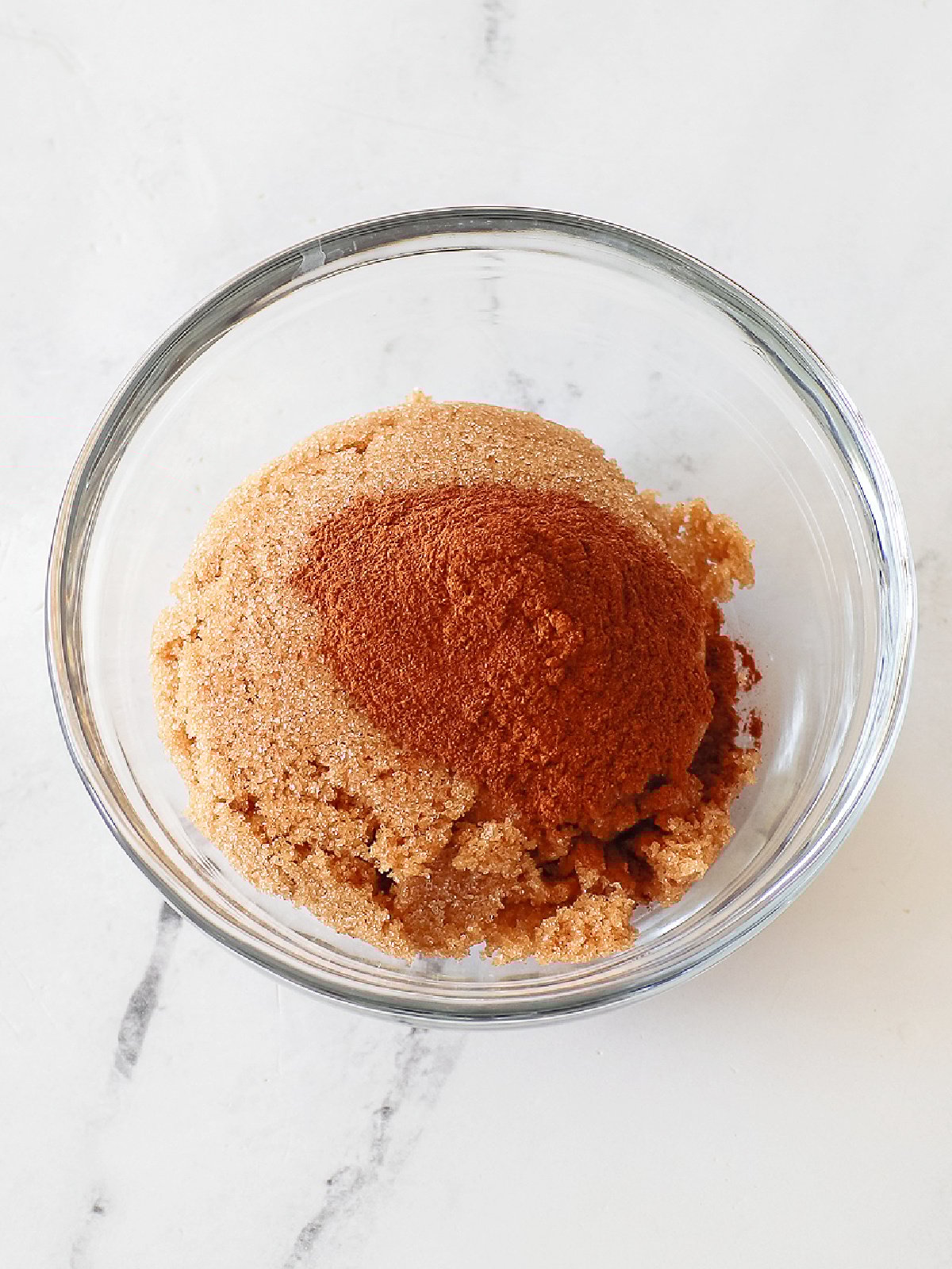 Cinnamon and brown sugar mixed together in a small bowl.