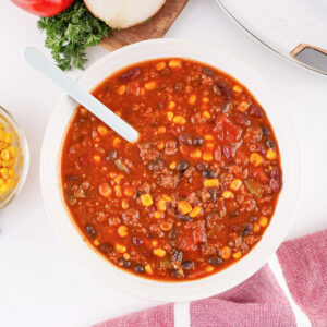 Overhead view of Cowboy Soup served in a bowl with a spoon.