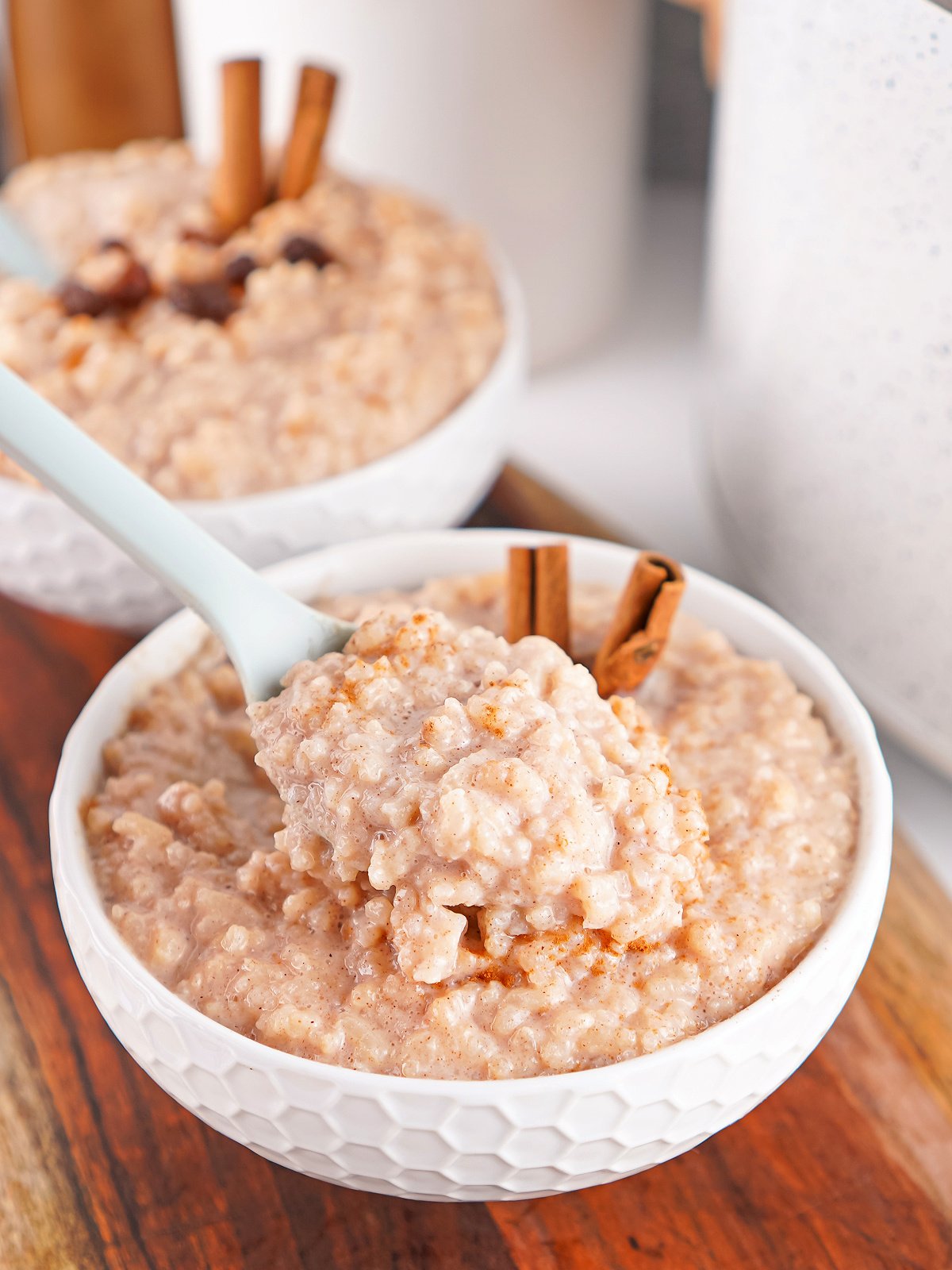 Close-up of creamy rice pudding in a white bowl.