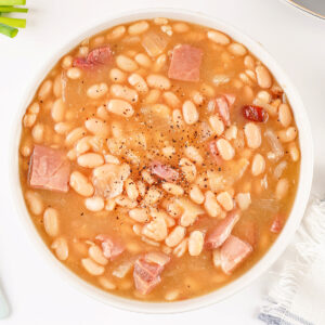 A comforting bowl of homemade ham and bean soup served warm.