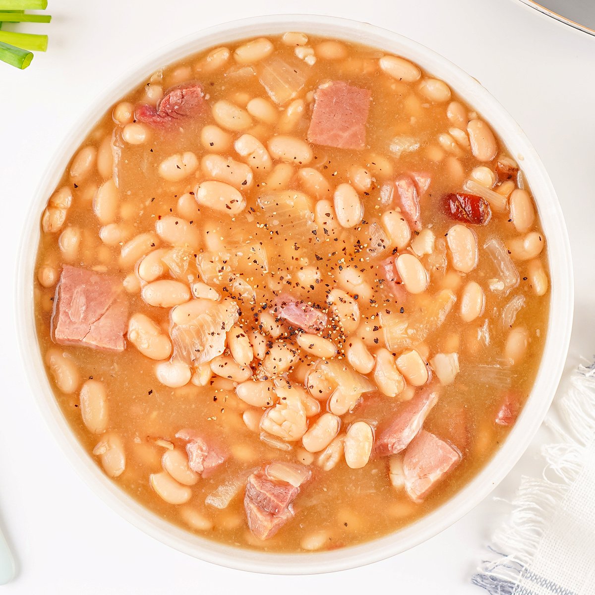 A comforting bowl of homemade ham and bean soup served warm.