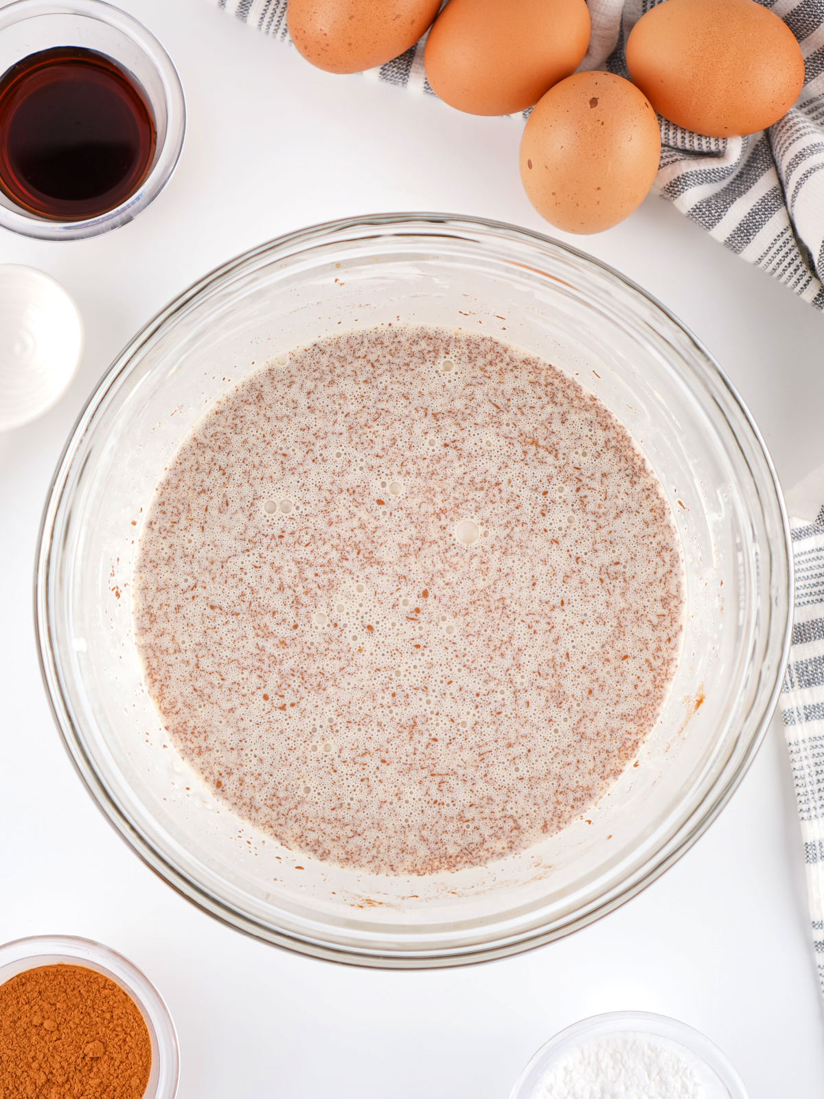 Cinnamon custard mixture in a large mixing bowl.
