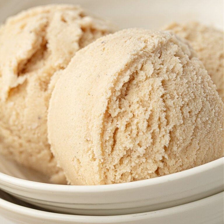 Close-up of creamy high protein vanilla ice cream with smooth scoop texture.