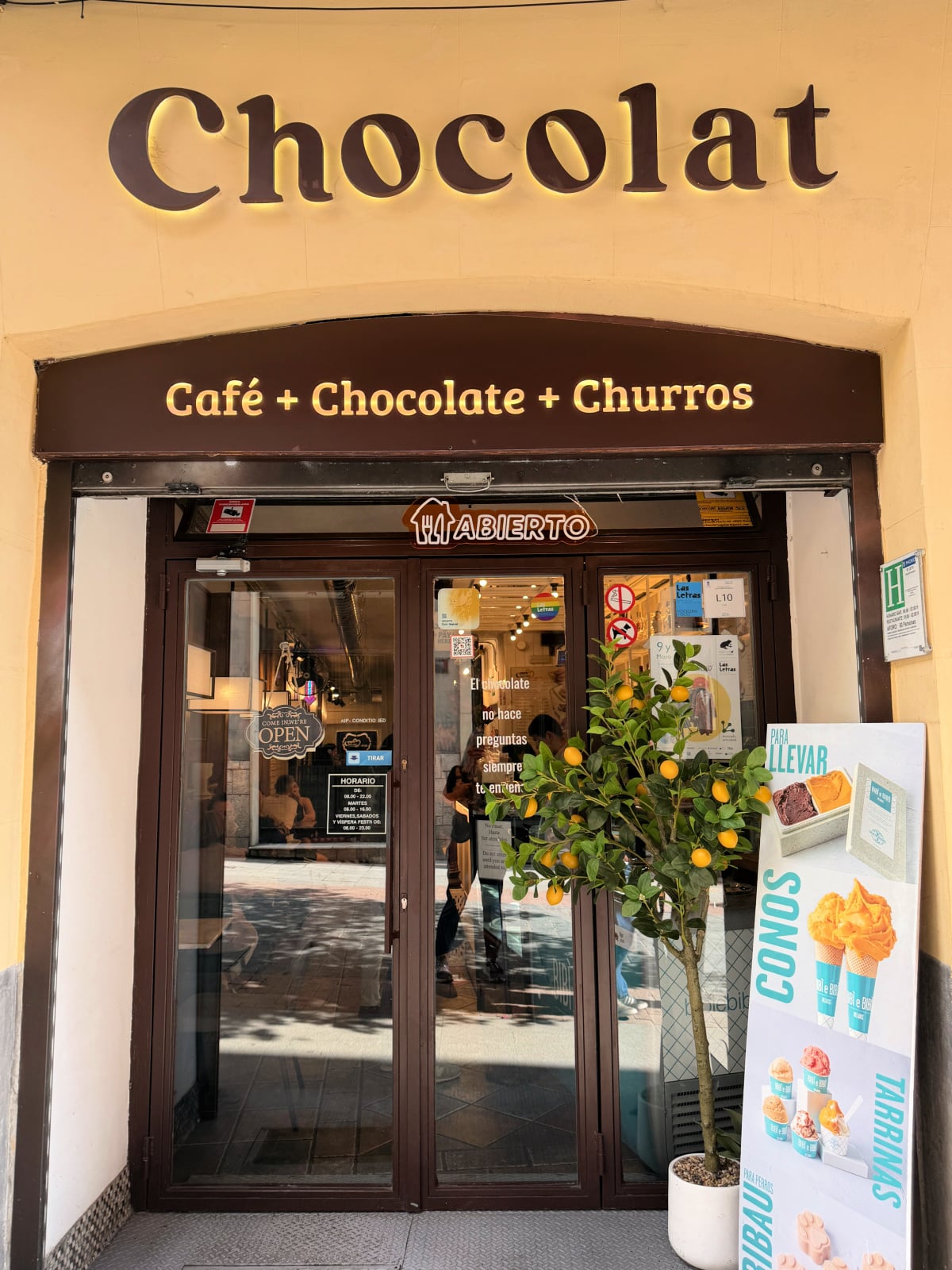 Exterior of Chocolat café in Madrid, known for churros, chocolate, and coffee.