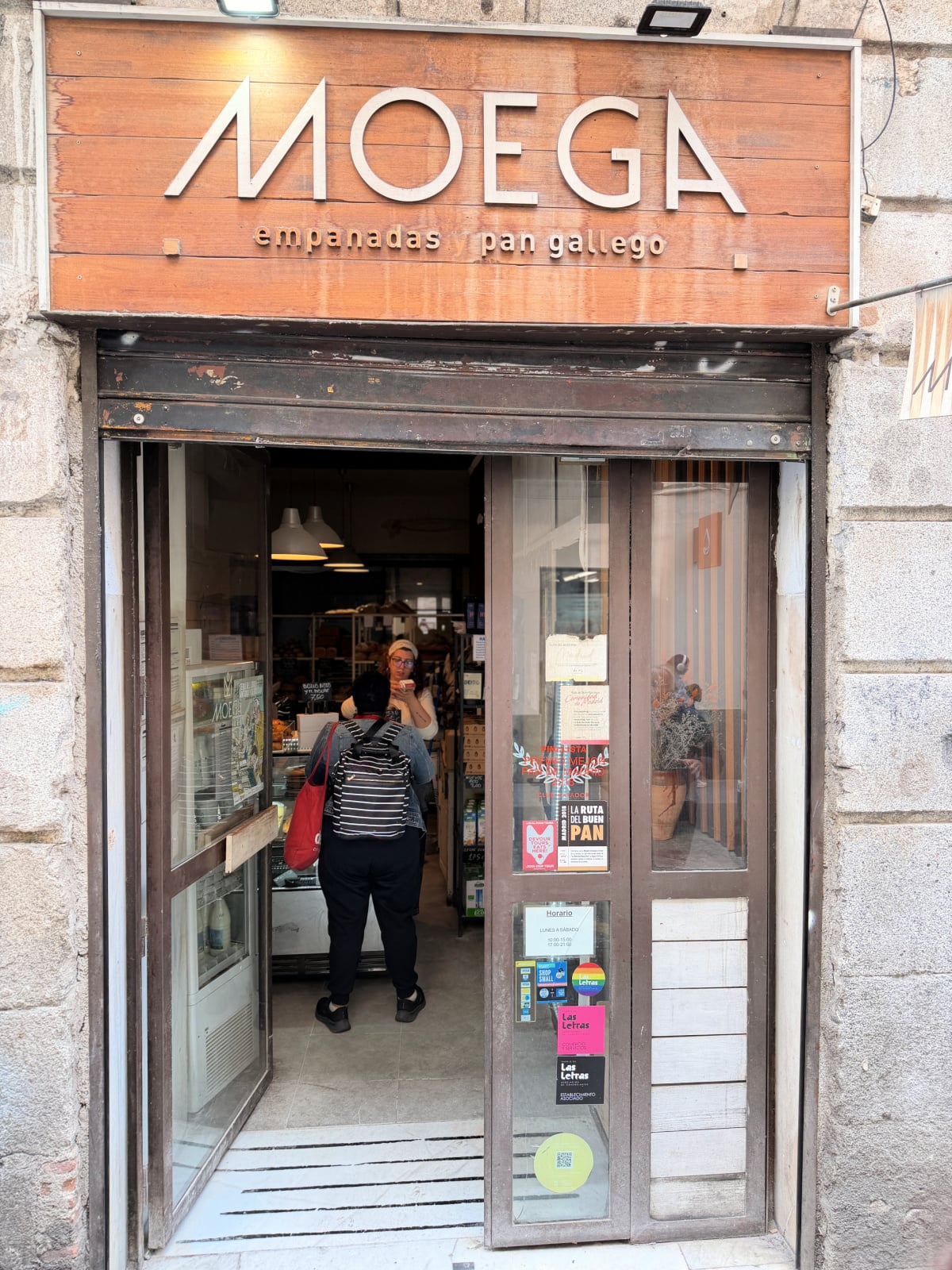 Entrance to Moega bakery in Madrid, specializing in empanadas and Galician bread.