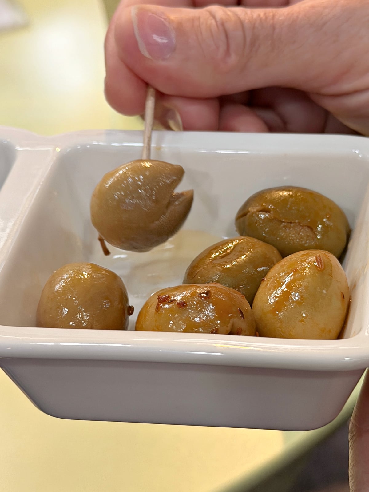 Close-up of seasoned Spanish olives.