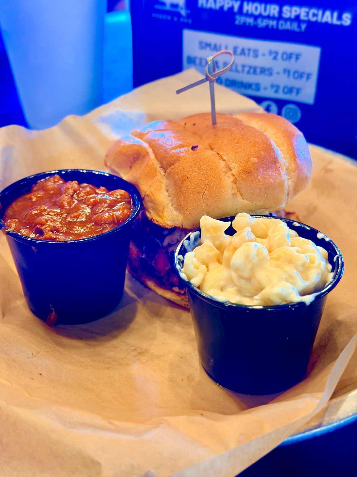 Barbecue sandwich served with baked beans and creamy macaroni and cheese at Hog Wild Beach & BBQ.